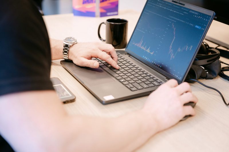 An ACEN employee typing on a keyboard.