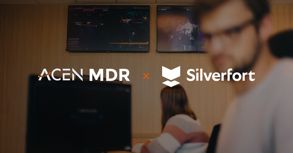 Photo taken inside Acen's SOC, with the ACEN MDR and Silverfort logo on top.